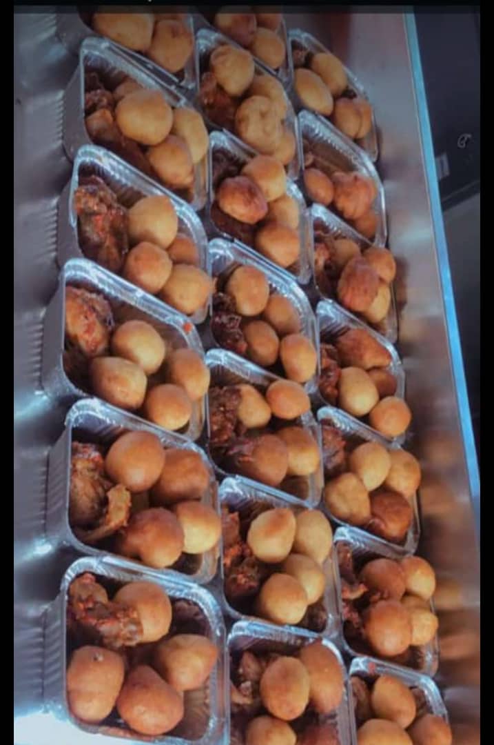 Small chops foil containers with puff-puff and peppered meat