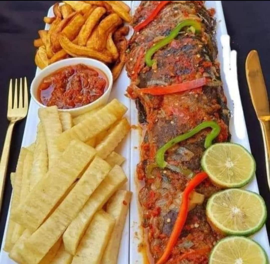 Juliagrills whole grilled fish with fried plantain and yam chips