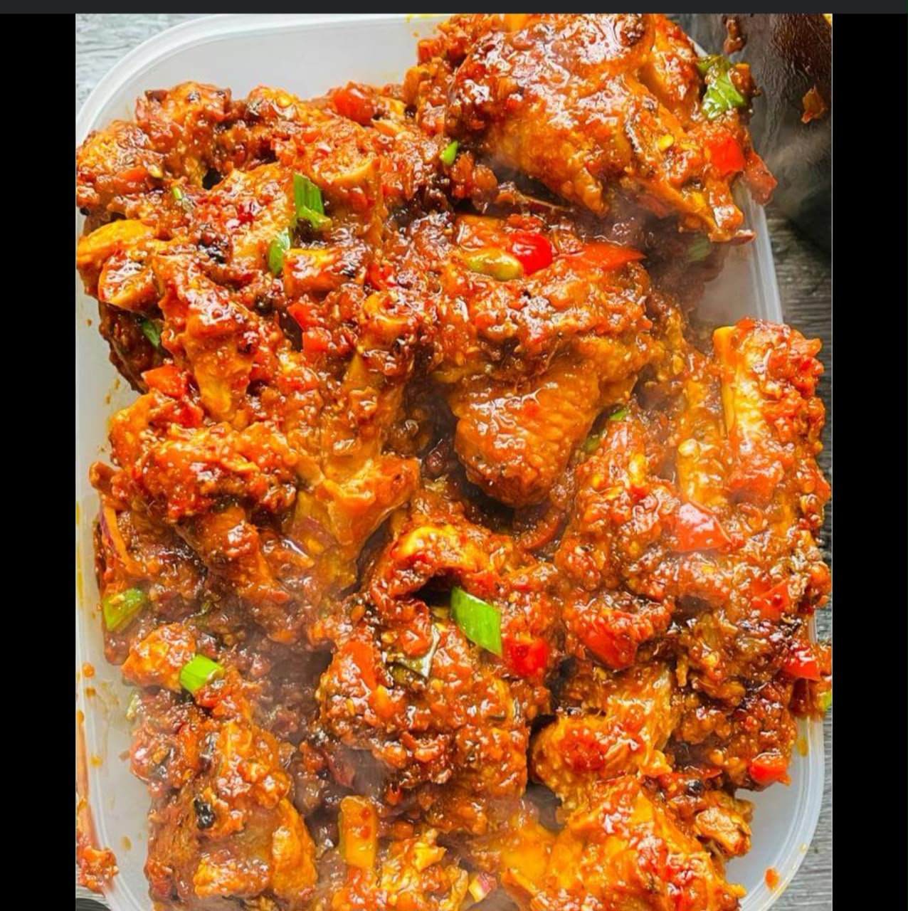 Spicy Peppered Chicken tossed with scotch bonnets and bell peppers