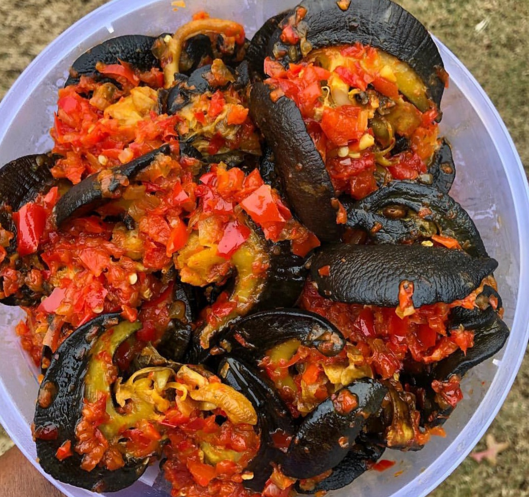 Spicy Peppered Snails tossed with red scotch bonnets and bell peppers